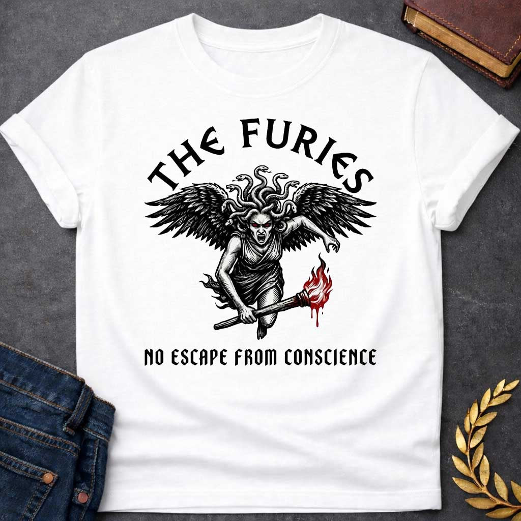 White T-shirt with a Dramatic illustration of the Furies, the Greek goddesses of vengeance and punishment. A winged female figure with serpents for hair and red glowing eyes holds a flaming torch. Bold black engraving style with red flame accents. Large dark wings extend from her back, and her expression is fierce and angry. Text reads 'THE FURIES' above and 'NO ESCAPE FROM CONSCIENCE' below. References the Erinyes, divine agents of justice pursuing the guilty.