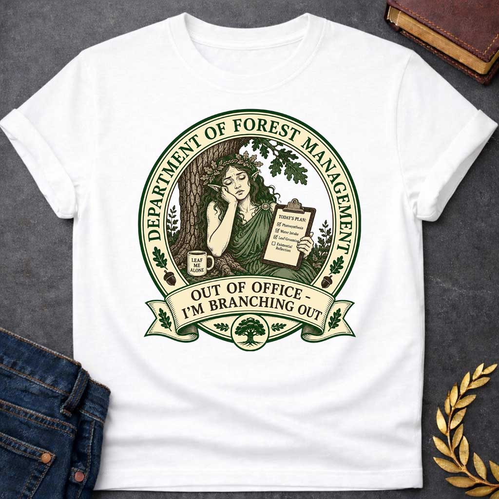 White T-shirt with a Humorous official seal depicting a forest goddess managing her day. A woman with long hair and oak leaf crown leans against a tree trunk holding a clipboard listing "Photosynthesis," "Water Intake," "Leaf Grooming," and "Existential Reflection." A mug reads "Leaf Me Alone." Surrounded by oak leaves and acorns. Text reads "Department of Forest Management" and "Out of Office - I'm Branching Out." Green and cream design celebrates nature and forest wisdom.