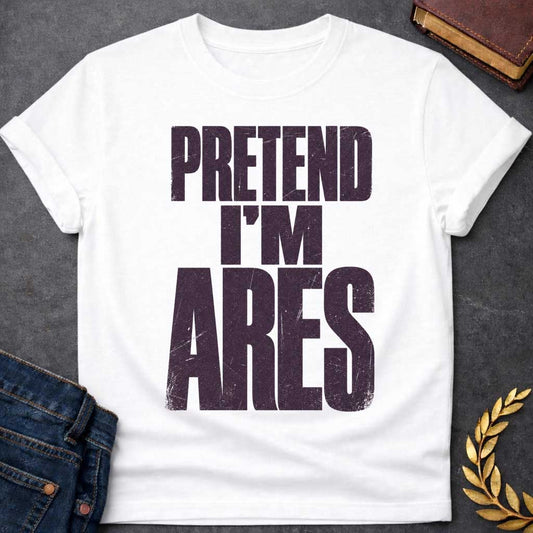 White t-shirt with a Pretend I’m Ares Greek mythology design featuring bold distressed purple typography on a transparent background. The stacked text reads “PRETEND I’M ARES” in a rugged vintage block font, creating a humorous Greek god design inspired by Ares, the god of war, courage, battle, and martial strength.