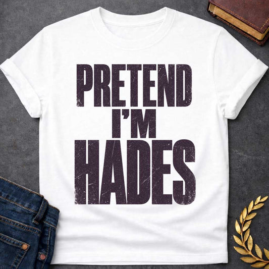 White t-shirt with a Pretend I’m Hades Greek mythology design featuring bold distressed dark purple typography on a transparent background. The stacked text reads “PRETEND I’M HADES” in a rugged vintage block font, creating a humorous design inspired by Hades, the Greek god of the underworld, the dead, and riches.