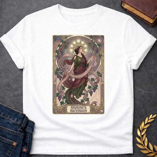 White T-shirt with An Art Nouveau-style t-shirt graphic. Modeled like a tarot card, a graceful Greek woman floats upward, wearing a flowing green and plum gown beneath a crown of glowing stars. She is framed by an elegant, ornate golden border interwoven with purple grapevines and Greek key patterns. A decorative banner at the base displays the title "ARIADNE'S ASCENSION" in a stylized font.
