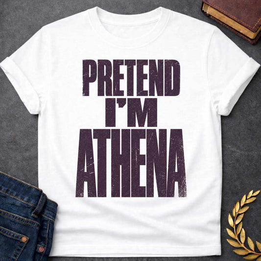 White t-shirt with a Pretend I’m Athena Greek mythology design featuring bold distressed purple typography on a transparent background. The stacked text reads “PRETEND I’M ATHENA” in a rugged vintage block font, creating a humorous design inspired by Athena, the Greek goddess of wisdom, warfare, strategy, and crafts.
