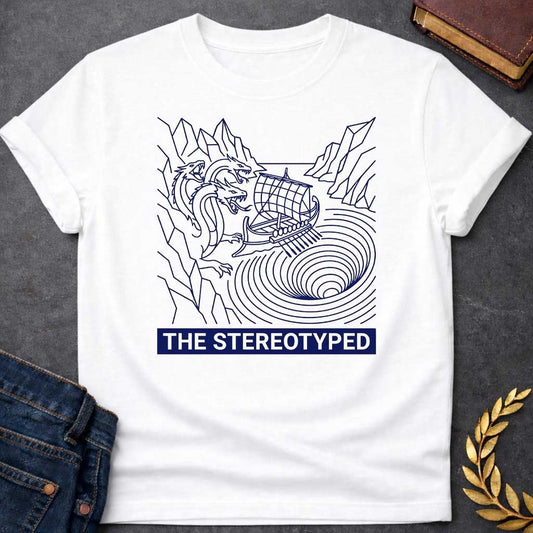 White t-shirt with A clean, line art t-shirt design. Rendered in dark blue line work, an ancient Greek galley ship navigates between a three-headed sea monster on jagged cliffs and a concentric, swirling whirlpool. Below the graphic, a solid dark blue rectangular banner features white, sans-serif block text that reads "THE STEREOTYPED".