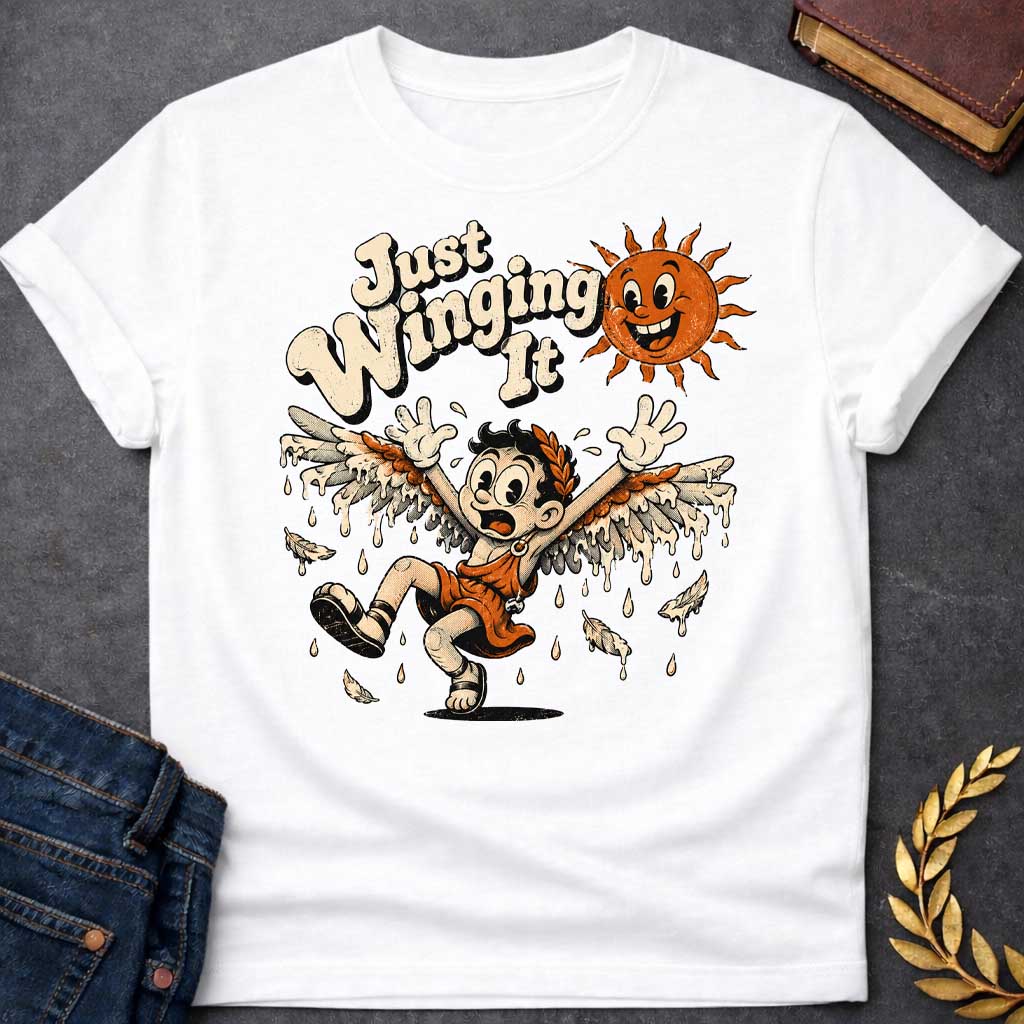 White t-shirt with a vintage 1930s rubber-hose cartoon style  design. A panicked boy representing Icarus tumbles through the air with arms raised as his feathered wax wings melt into dripping drops. Above him, a cheerful retro sun character grins mischievously next to playful, bubbly text that reads "Just Winging It" in a distressed cream font.