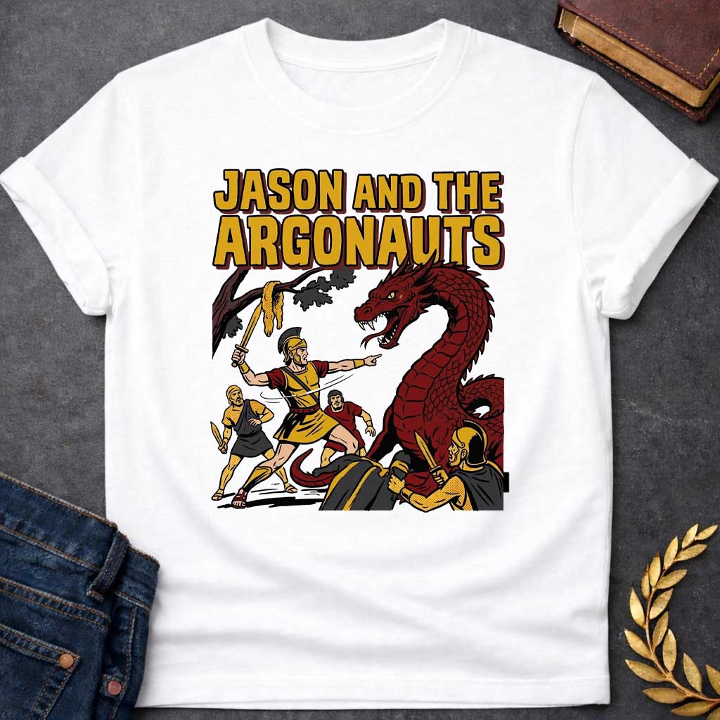 White T-shirt with A retro comic book style t-shirt design.  Bold yellow pop-art text at the top reads "JASON AND THE ARGONAUTS". Below, a Greek warrior in armor raises a sword near the Golden Fleece hanging from a tree branch, pointing toward a giant, snarling red dragon. Three fellow Argonauts surround the beast with swords drawn, featuring classic comic ben-day dot shading and thick black outlines