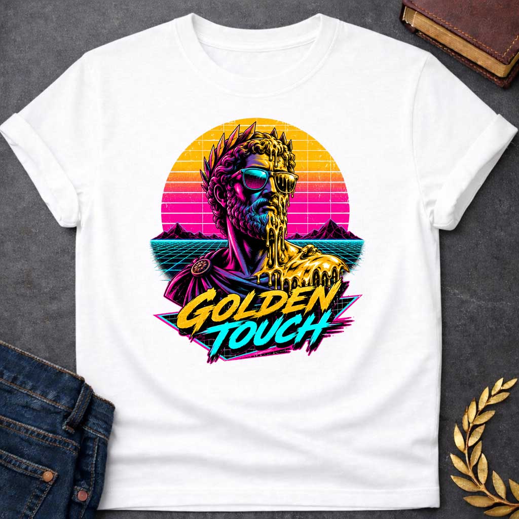White t-shirt with A Retro synthwave-inspired Greek mythology design featuring a stylized bust of King Midas wearing sunglasses as molten gold drips over half his face and shoulder. A vibrant neon sunset, grid landscape, and mountains create an 80s vaporwave backdrop. Bold brush lettering reads "Golden Touch" in gold and teal, using bright pink, purple, cyan, and gold for a striking vintage aesthetic.