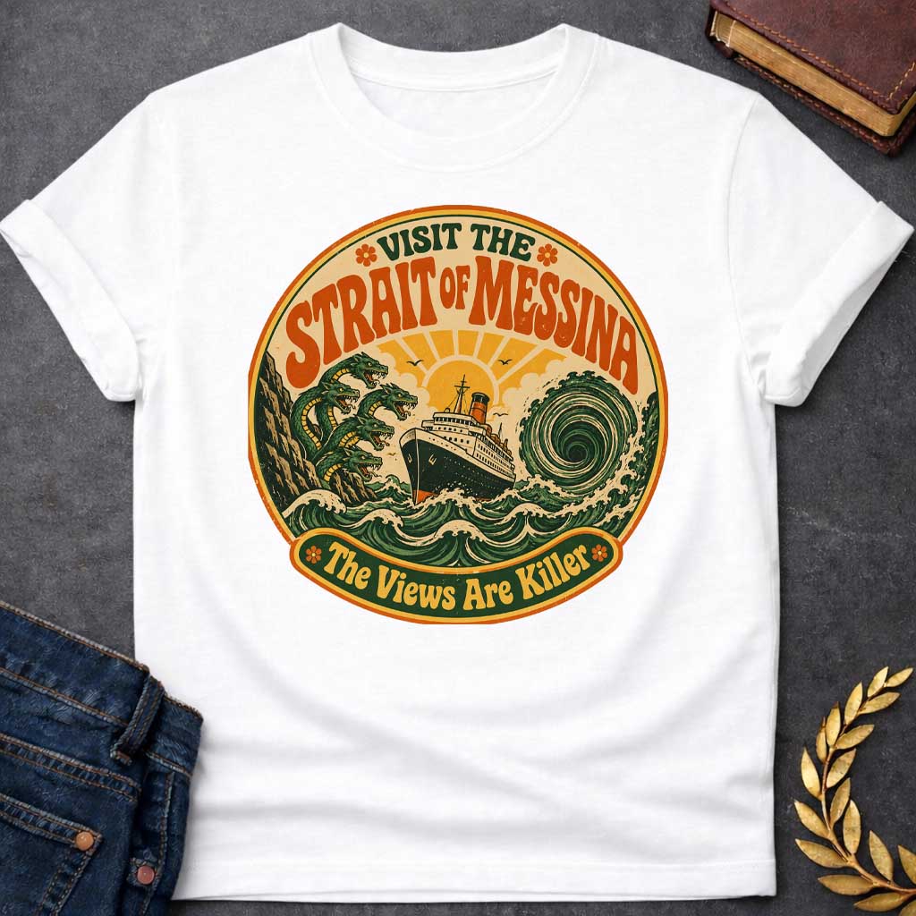 White t-shirt with A retro 70s travel-poster style design.  Inside a circular badge with a warm sunset, a vintage ocean liner sails between six-headed serpent Scylla and a swirling green whirlpool. Arched bold orange text reads "VISIT THE STRAIT OF MESSINA" at the top, while a bottom banner reads "The Views Are Killer" flanked by small flower icons in a distressed groovy aesthetic.