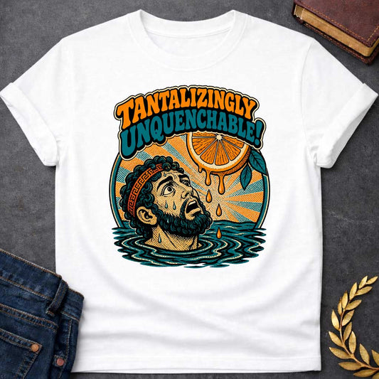 White t-shirt with a retro pop-art design inspired by the myth of Tantalus. Inside a circular badge with a sunburst background, a sweating Greek man submerged to his neck in water looks up in desperation at a juicy orange slice dangling just out of reach with dripping juice droplets. Playful 70s-style bubble lettering arched above reads "TANTALIZINGLY UNQUENCHABLE!" in bold orange and teal fonts.