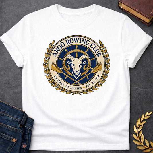 White T-shirt with A Nautical emblem of Argo Rowing Club in navy and gold featuring a golden ram's head at center, representing the mythological golden fleece. A ship's wheel rises above, flanked by crossed oars with Greek key patterns. Laurel wreaths frame the circular design. Text reads 'Argo Rowing Club' and 'Pacasae to Colchis Est. BRC 1300.' Celebrates the legendary quest of Jason and the Argonauts with modern rowing club aesthetics and classical maritime imagery.